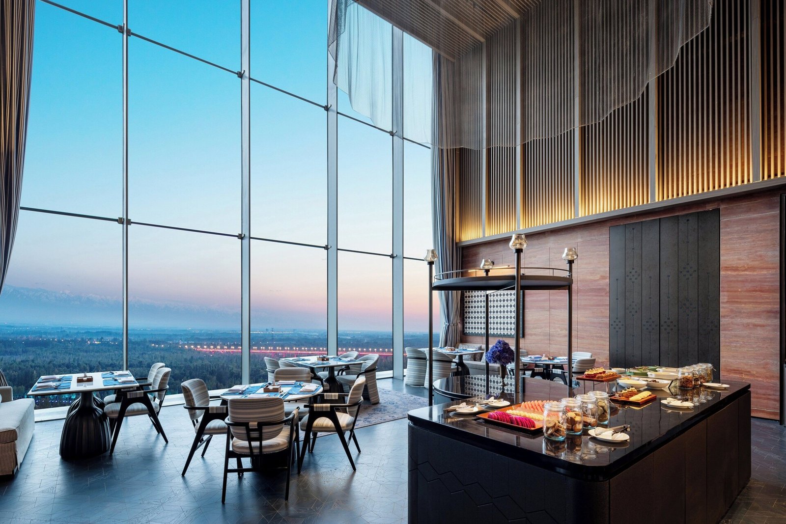 Intercontinental Yining By Ihg, at the table