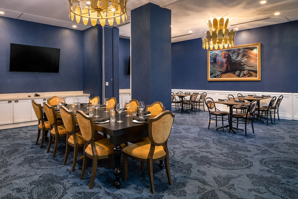 The Peregrine Omaha Downtown, Curio Collection by Hilton, at the table
