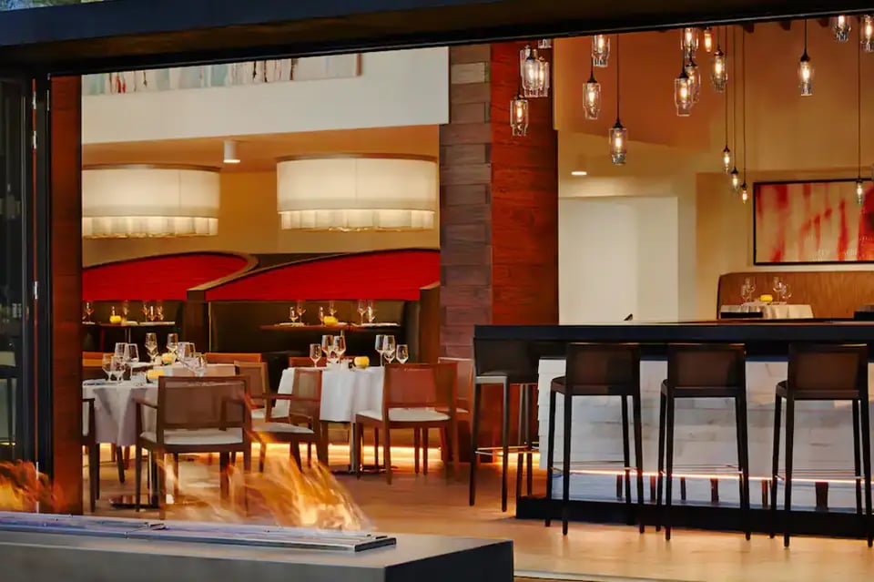Waterstone Resort & Marina Boca Raton, Curio Collection by Hilton, at the table