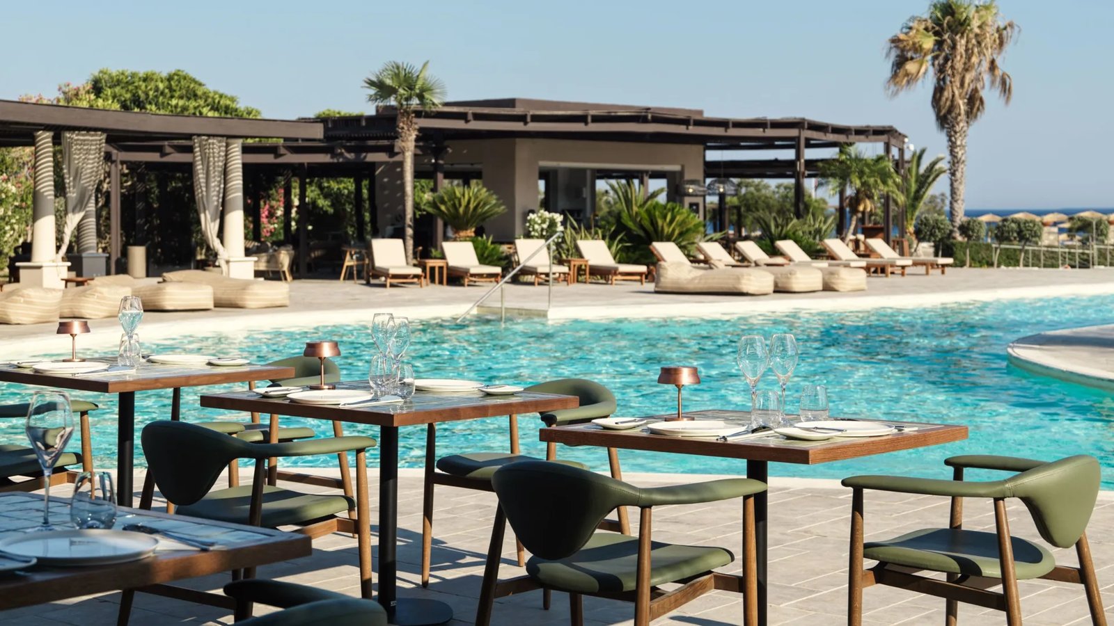 Aulūs Lindos Rhodes Resort, Curio Collection by Hilton, at the table