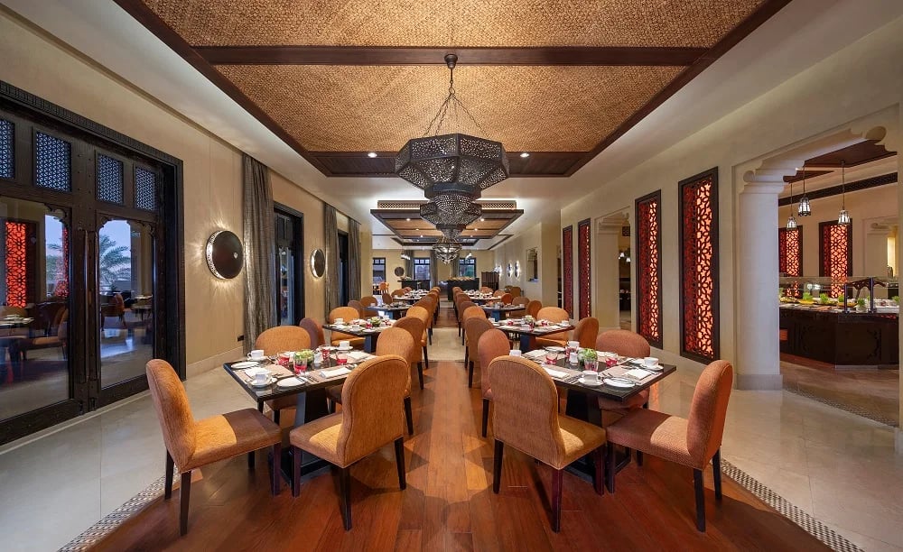 Qasr Al Sarab Desert Resort by Anantara, at the table