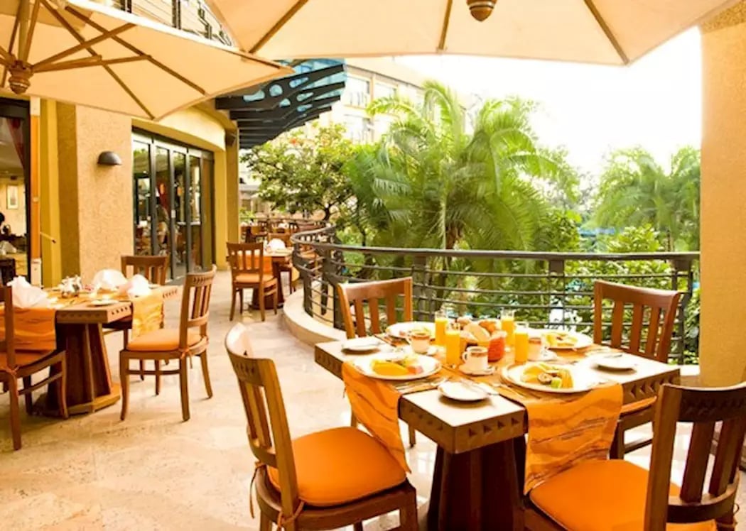 Kigali Serena Hotel, at the table