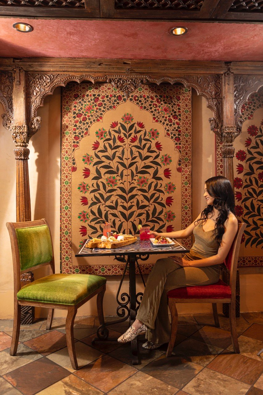 The Inn of The Five Graces, at the table