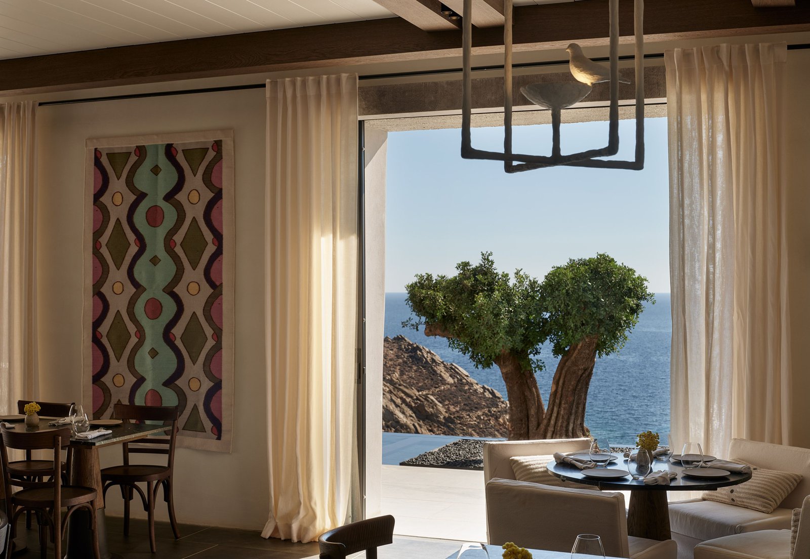 Odera, Tinos, Autograph Collection, at the table
