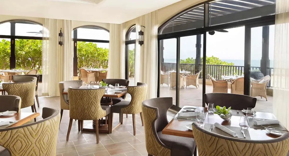 Desert Islands Resort & Spa by Anantara, at the table