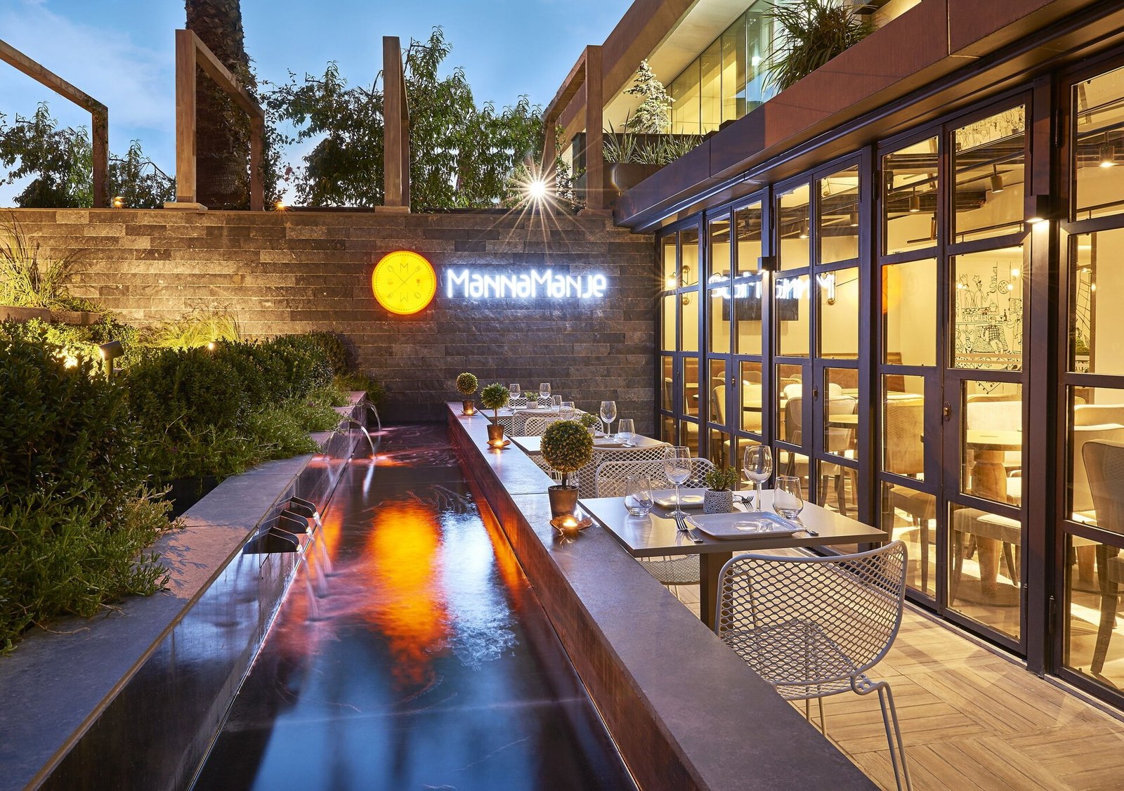 Manna Boutique Hotels, at the table